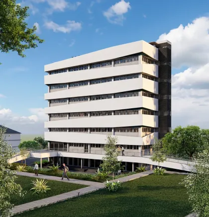 Modern multi-story building surrounded by greenery